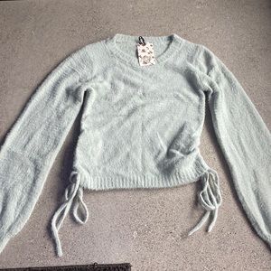 Hippie Rose Teal Sweater with ties on bottom. Size Small.